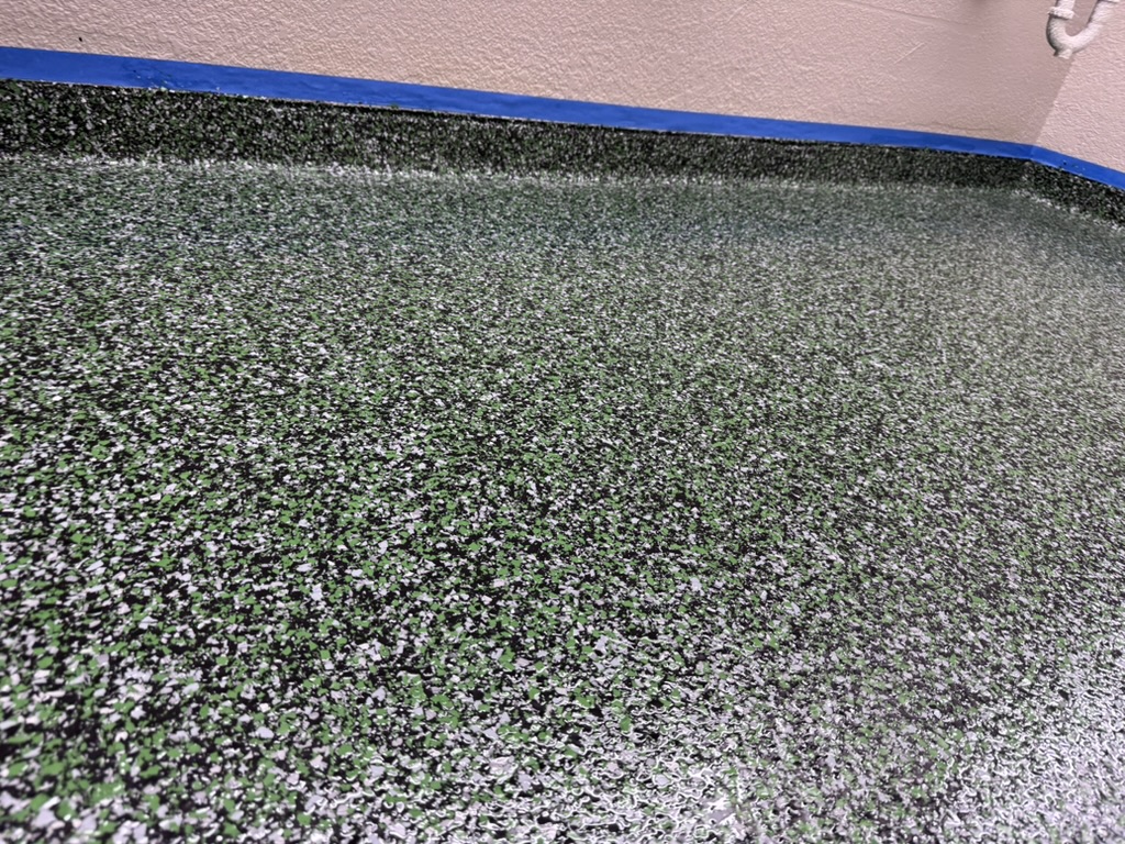 Close-up of a Carpet World resinous flooring finish
