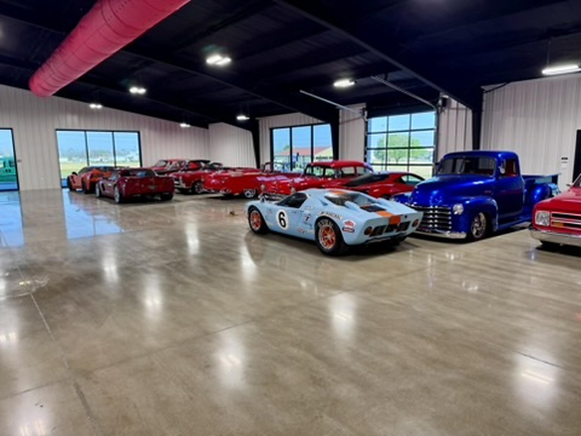 Completed Carpet World polished concrete installation in a vehicle showroom